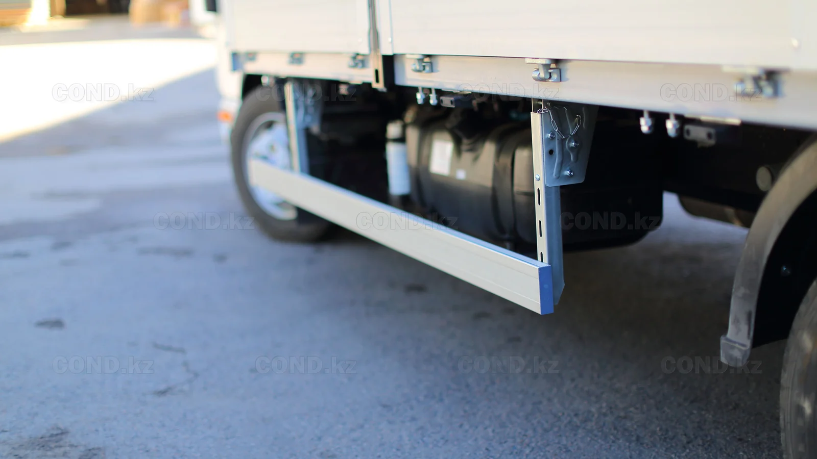 Flatbed platform on a JAC N56 chassis — a folding side board and the subframe — COND