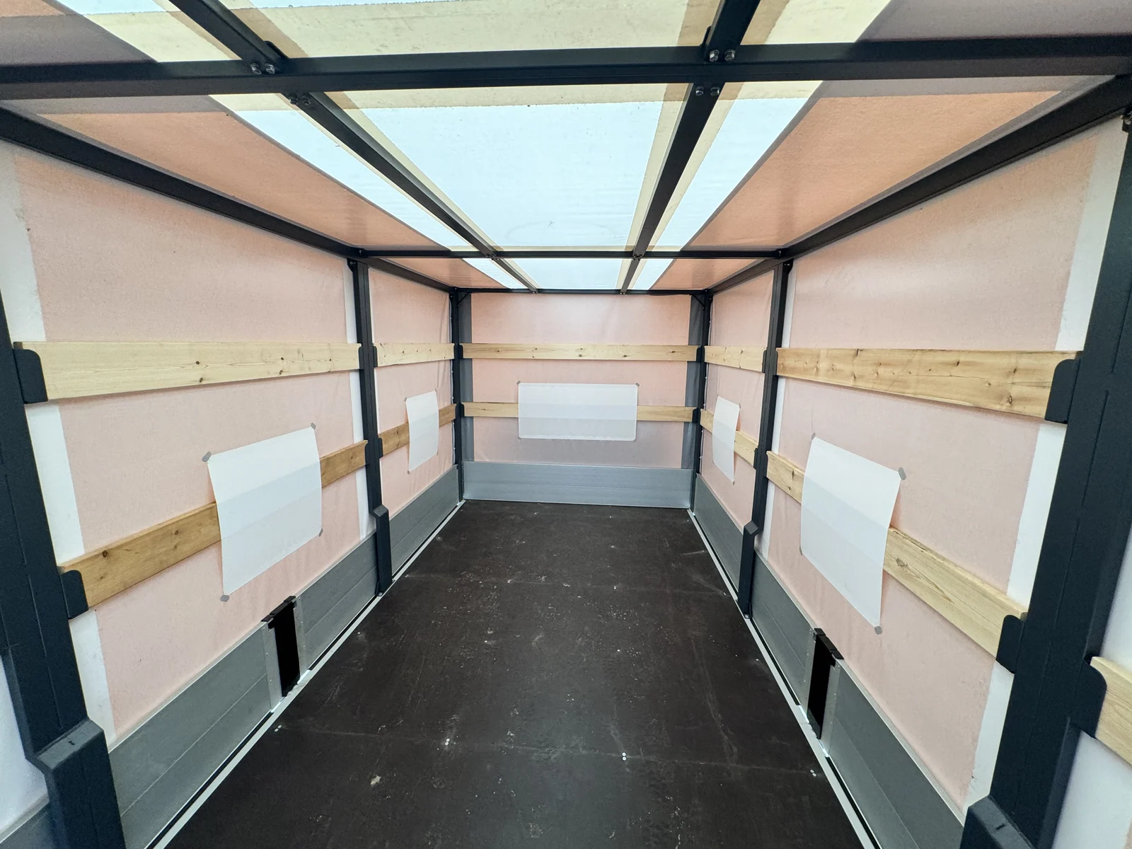 Curtain-side drop-side on a HINO 300 chassis — frame from inside, wooden rails along the sides — COND