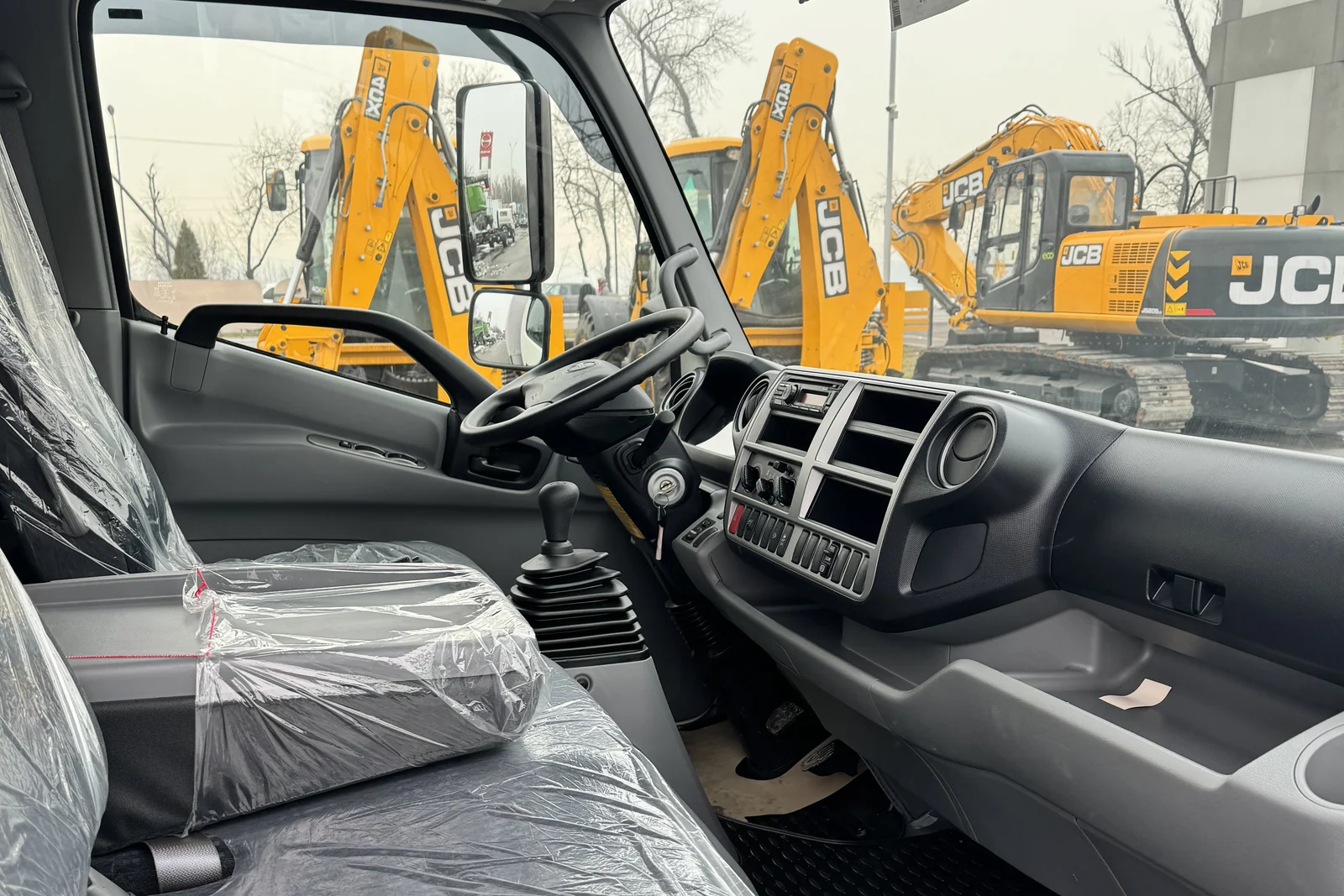 Curtain-side drop-side on a HINO 300 chassis — the driver’s workplace — COND