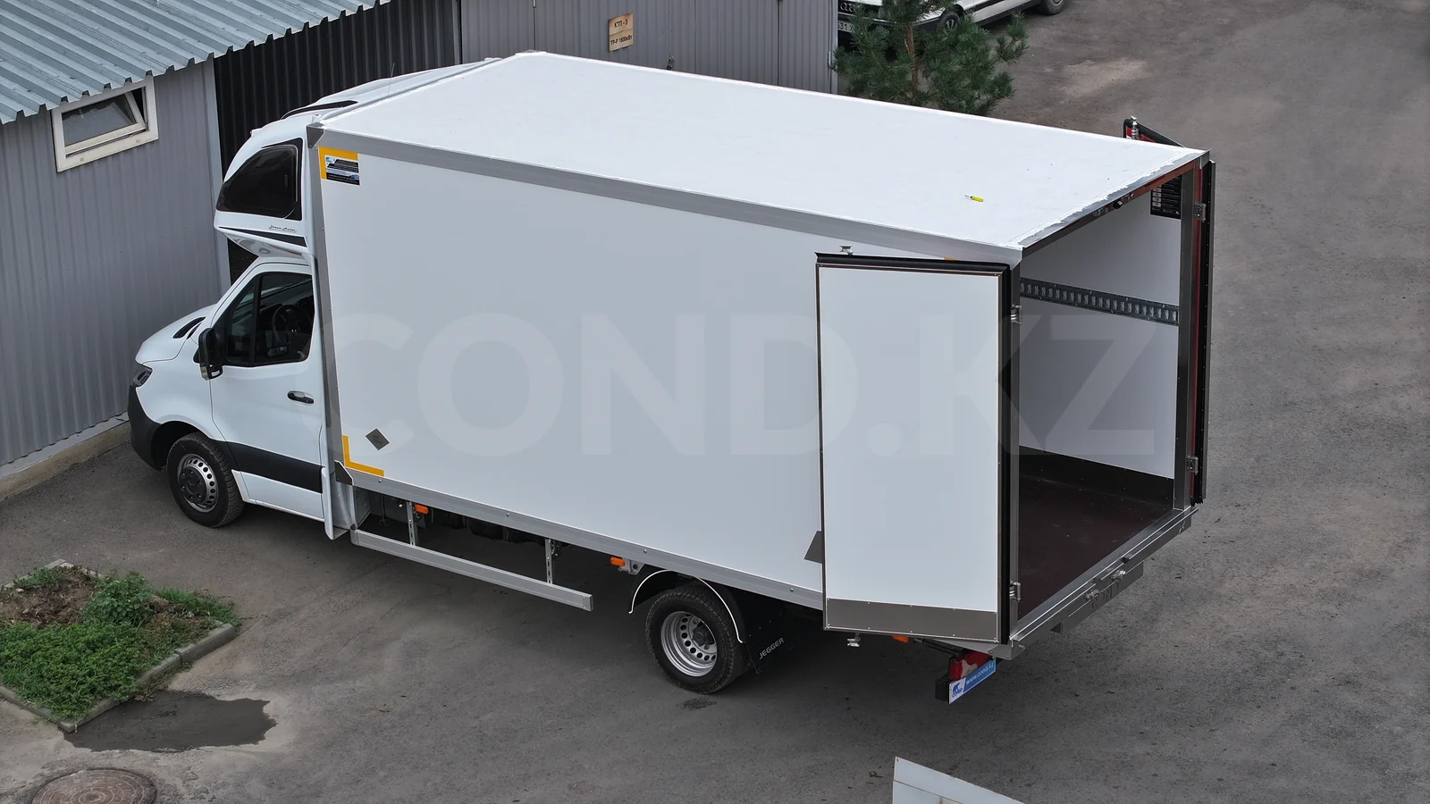 FRP insulated van on Mercedes-Benz Sprinter chassis — rear doors open: the body inside, a lashing rail along the wall — COND