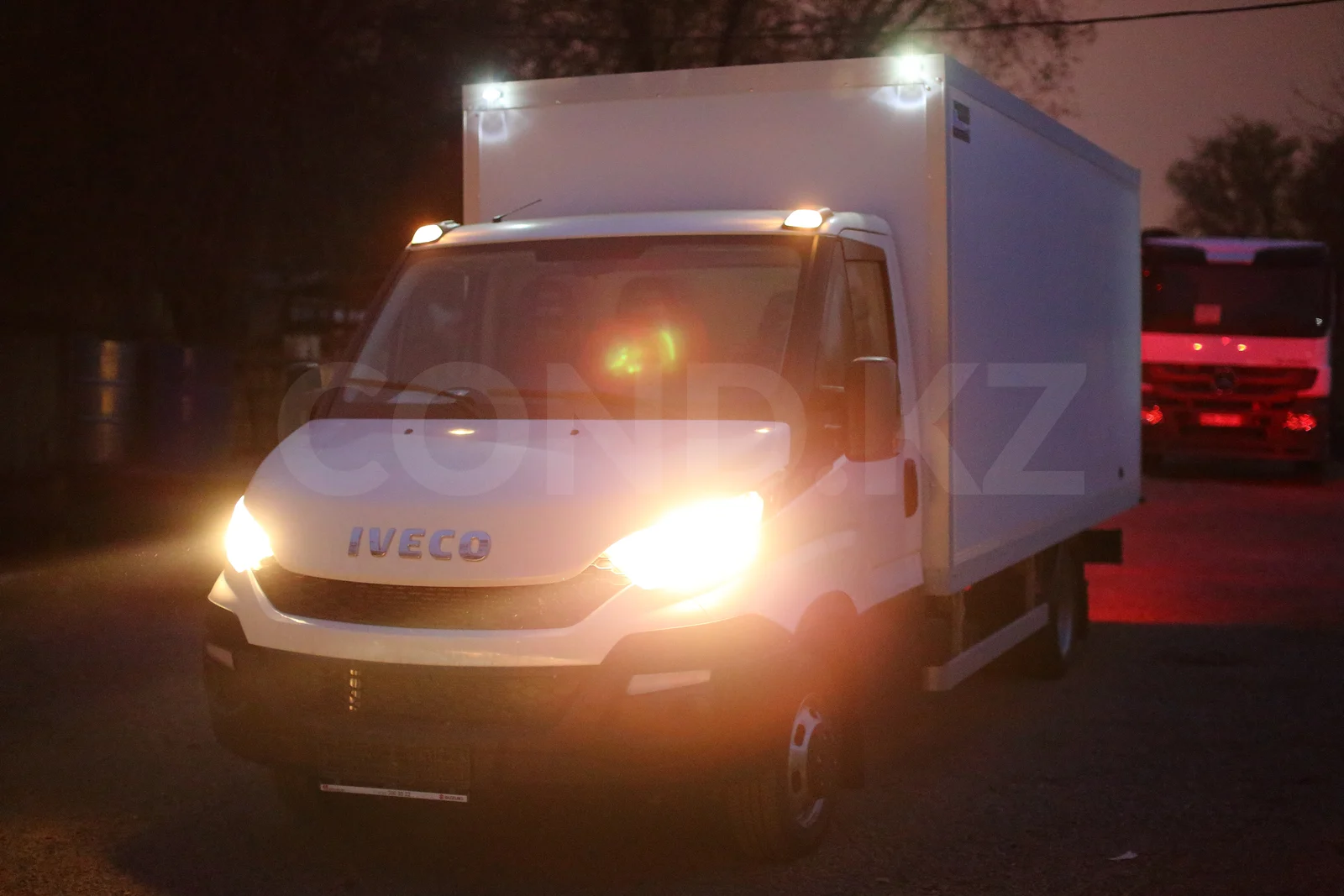 Iveco Daily 50C15 dry van in Almaty — the truck in evening light, marker lamps above the cab — COND