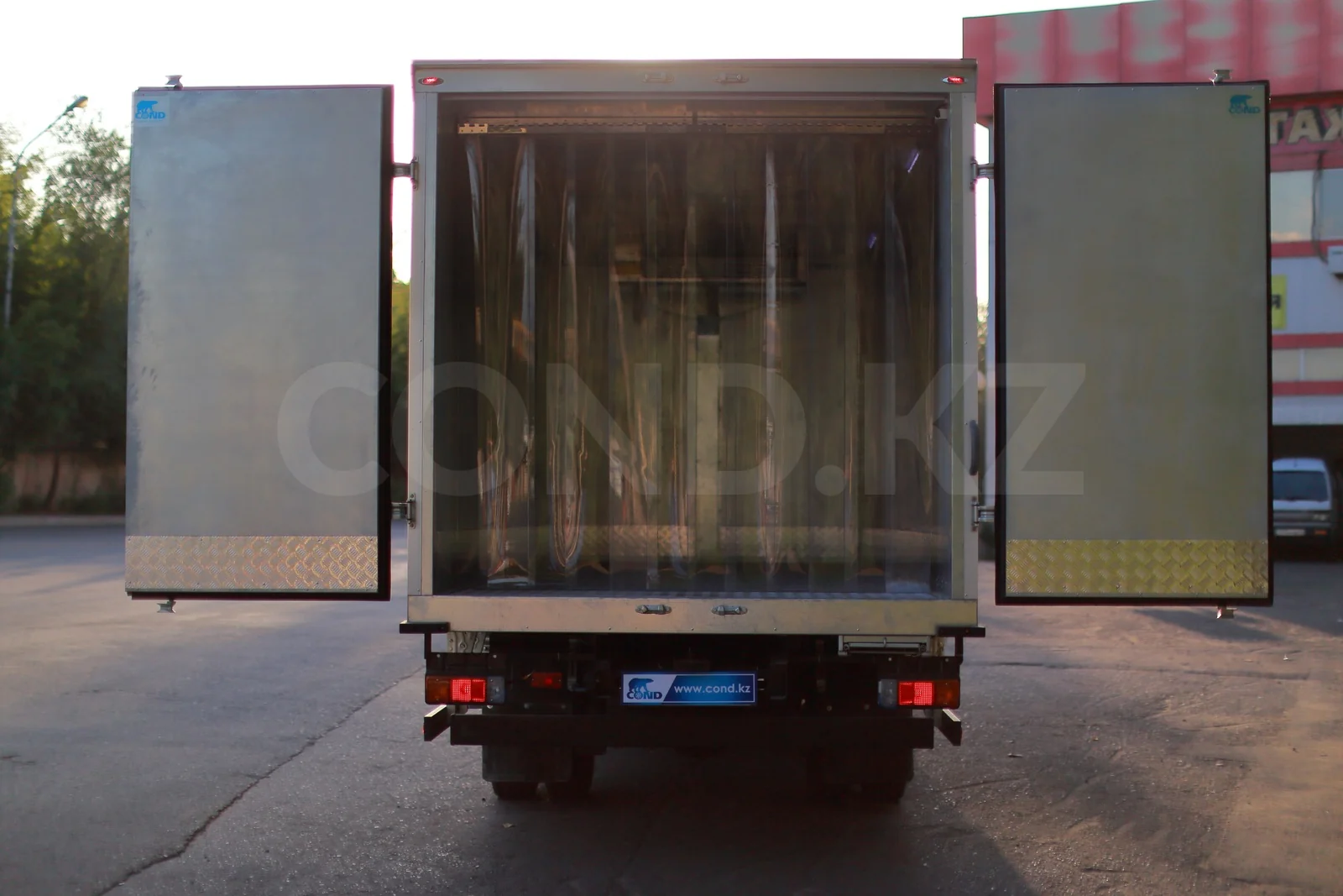 Refrigerated van on a HINO 300 with a strip curtain — rear doors open, PVC strip curtain in the opening — COND