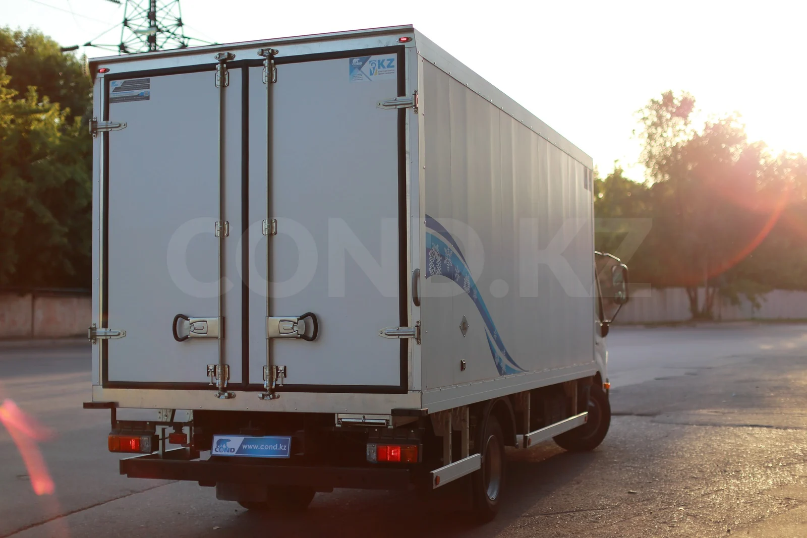 Refrigerated van on a HINO 300 with a strip curtain — rear doors closed — COND